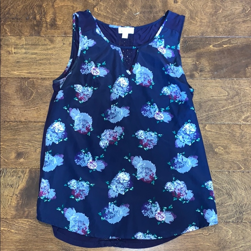 Floral print on navy sleeveless blouse